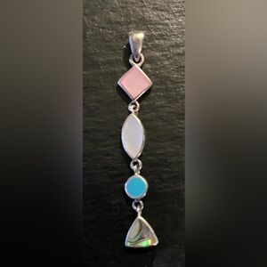 Vintage mother of pearl, abalone shell, and turquoise sterling silver pendant.